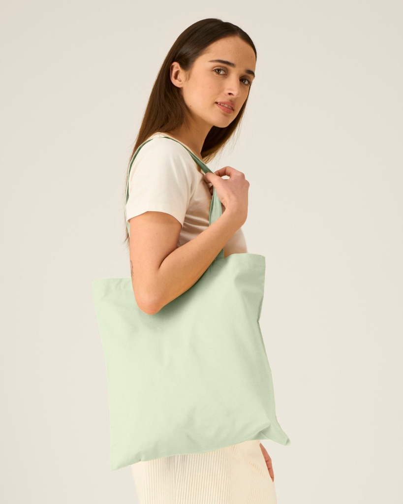 Light Tote Bag (Stem Green) - Front detail, model photo 1