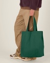 Mid Tote Bag (Bottle Green) - Front detail, model photo 1